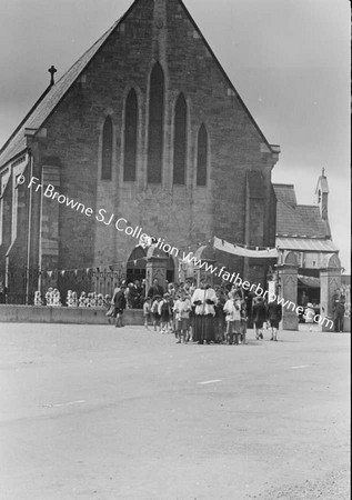 PROCESSION LEAVING CHURCH IN THE MAIN STREET